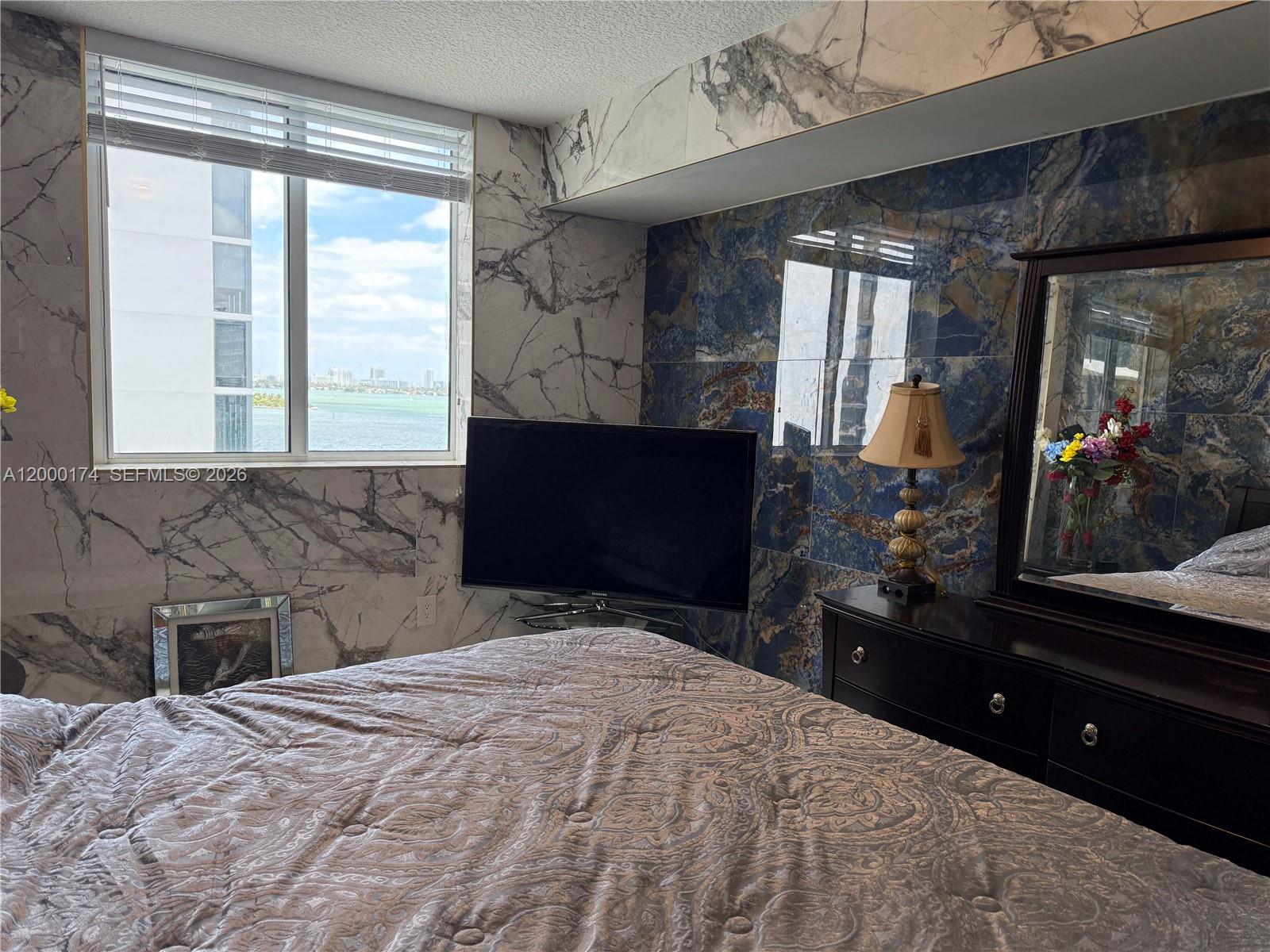 601 Northeast 23rd Street, Unit 903 Miami, FL 33137 - Photo 14 of 61 a bedroom with a bed and a large window