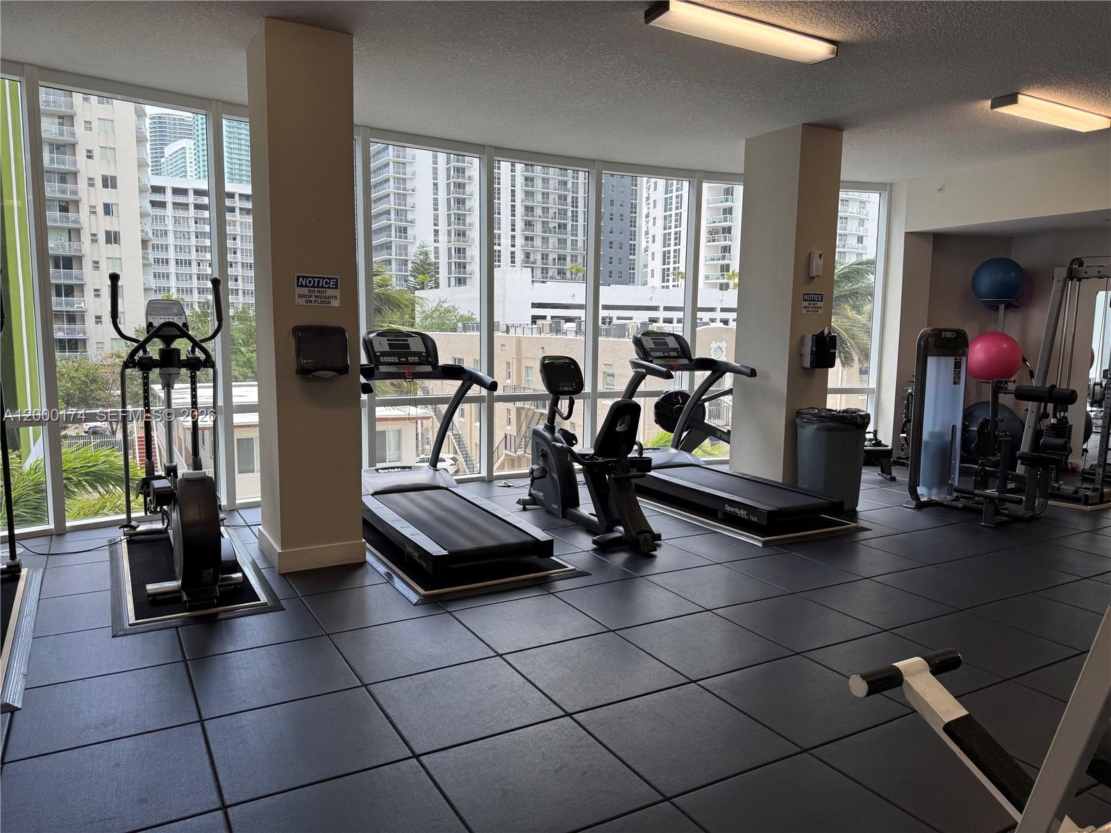 601 Northeast 23rd Street, Unit 903 Miami, FL 33137 - Photo 31 of 61 a view of a room with gym equipment
