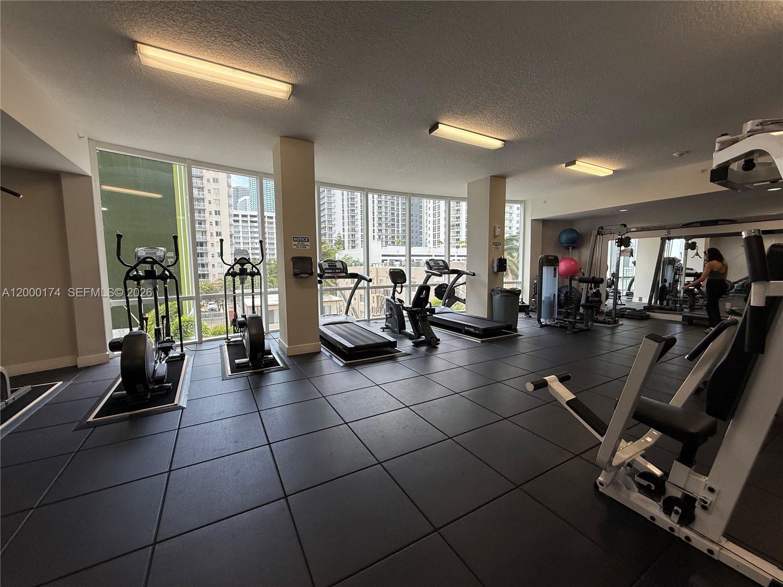 601 Northeast 23rd Street, Unit 903 Miami, FL 33137 - Photo 32 of 61 a view of a room with gym equipment