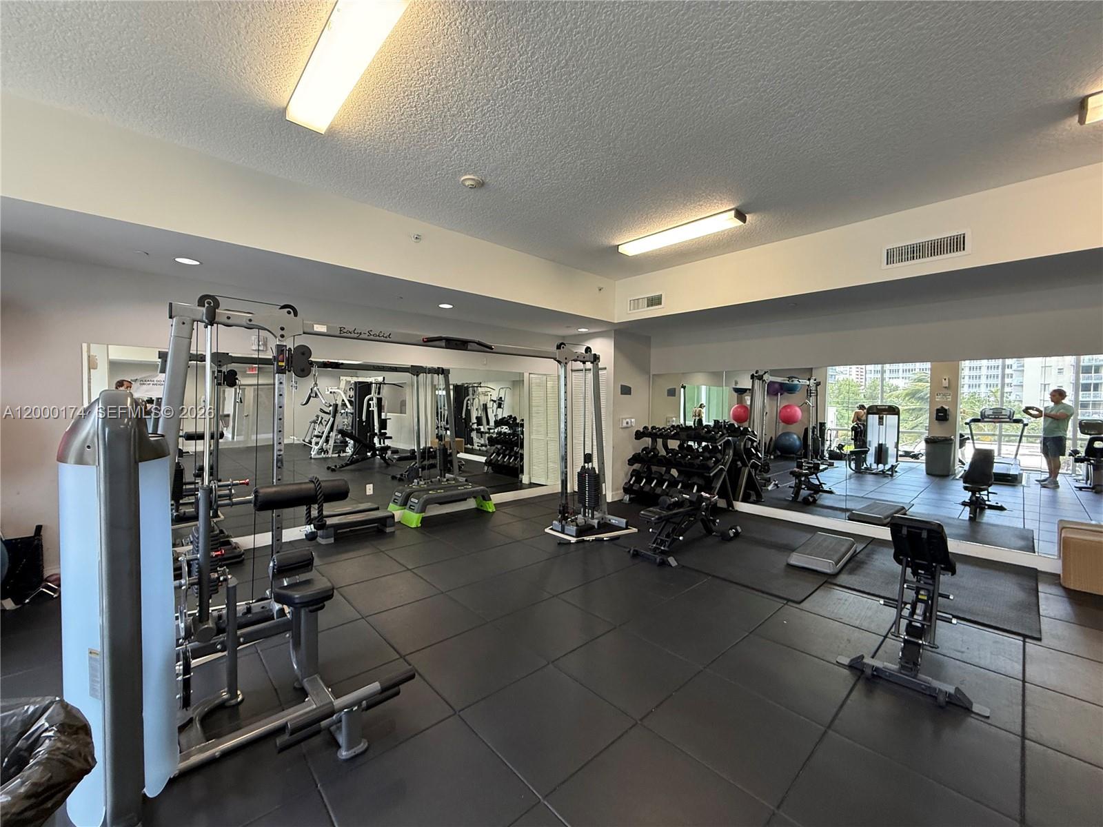 601 Northeast 23rd Street, Unit 903 Miami, FL 33137 - Photo 33 of 61 a view of a room with gym equipment