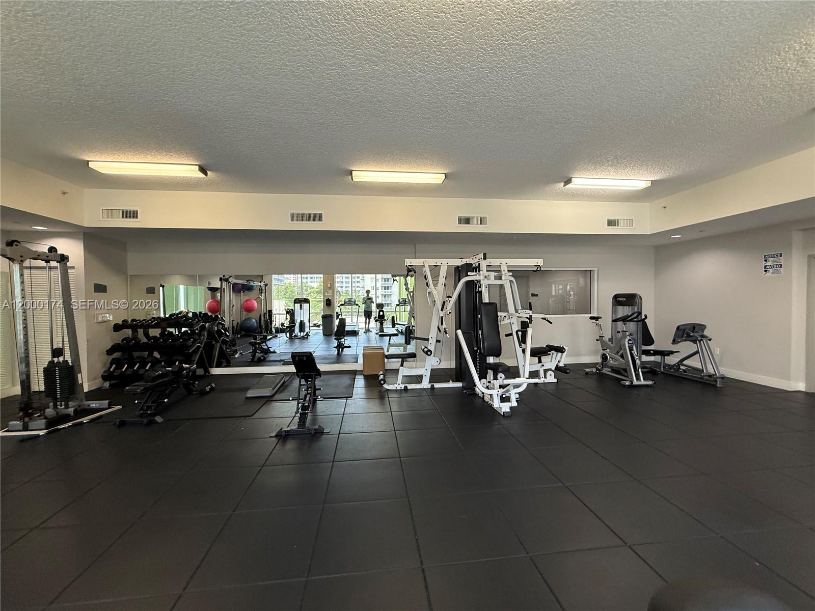 601 Northeast 23rd Street, Unit 903 Miami, FL 33137 - Photo 34 of 61 a view of a room with gym equipment