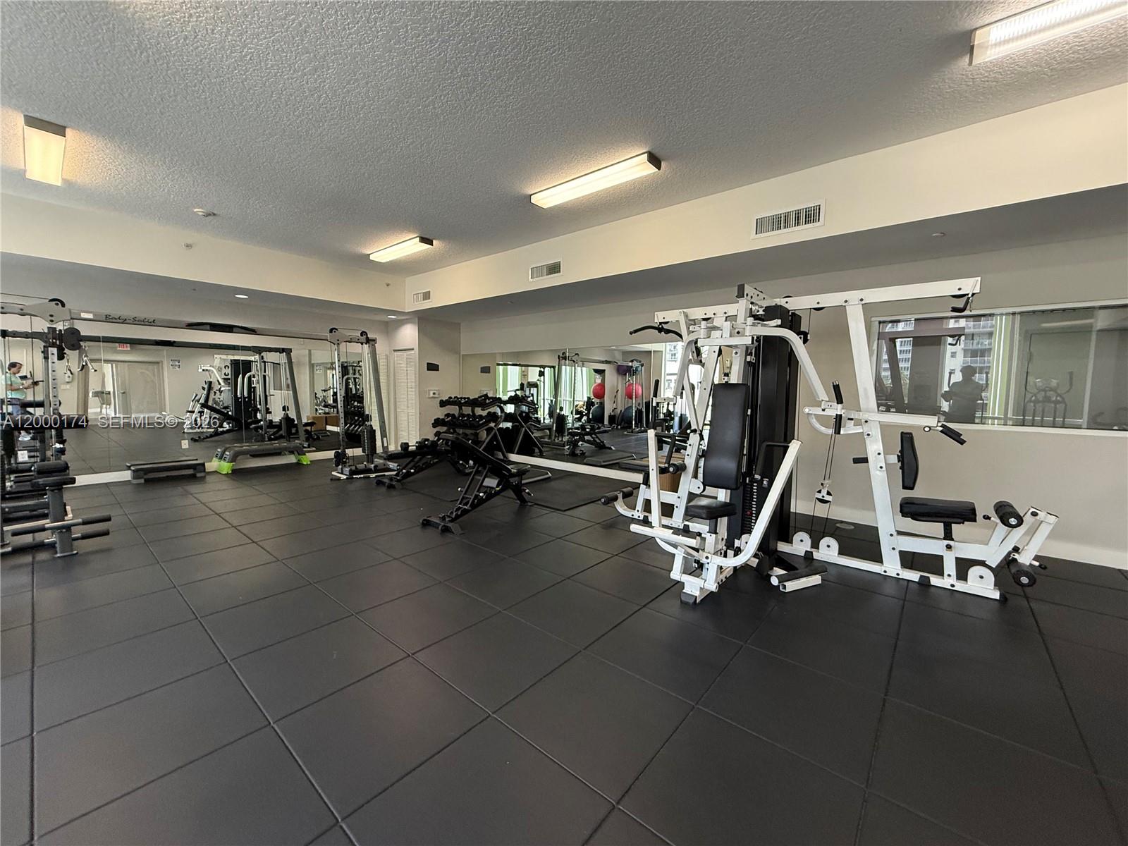601 Northeast 23rd Street, Unit 903 Miami, FL 33137 - Photo 36 of 61 a view of a room with gym equipment
