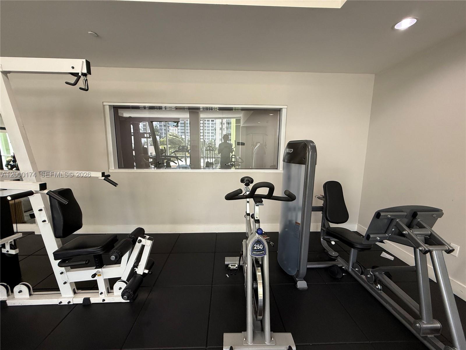 601 Northeast 23rd Street, Unit 903 Miami, FL 33137 - Photo 37 of 61 a view of a workspace with furniture and a window