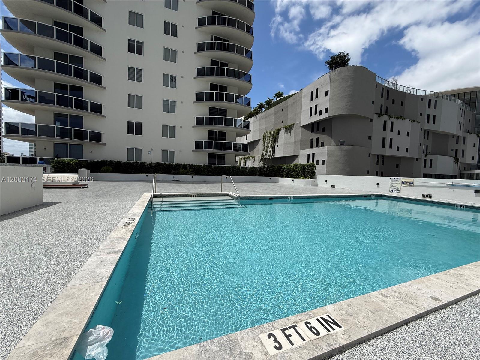 601 Northeast 23rd Street, Unit 903 Miami, FL 33137 - Photo 44 of 61 a view of a house with a swimming pool