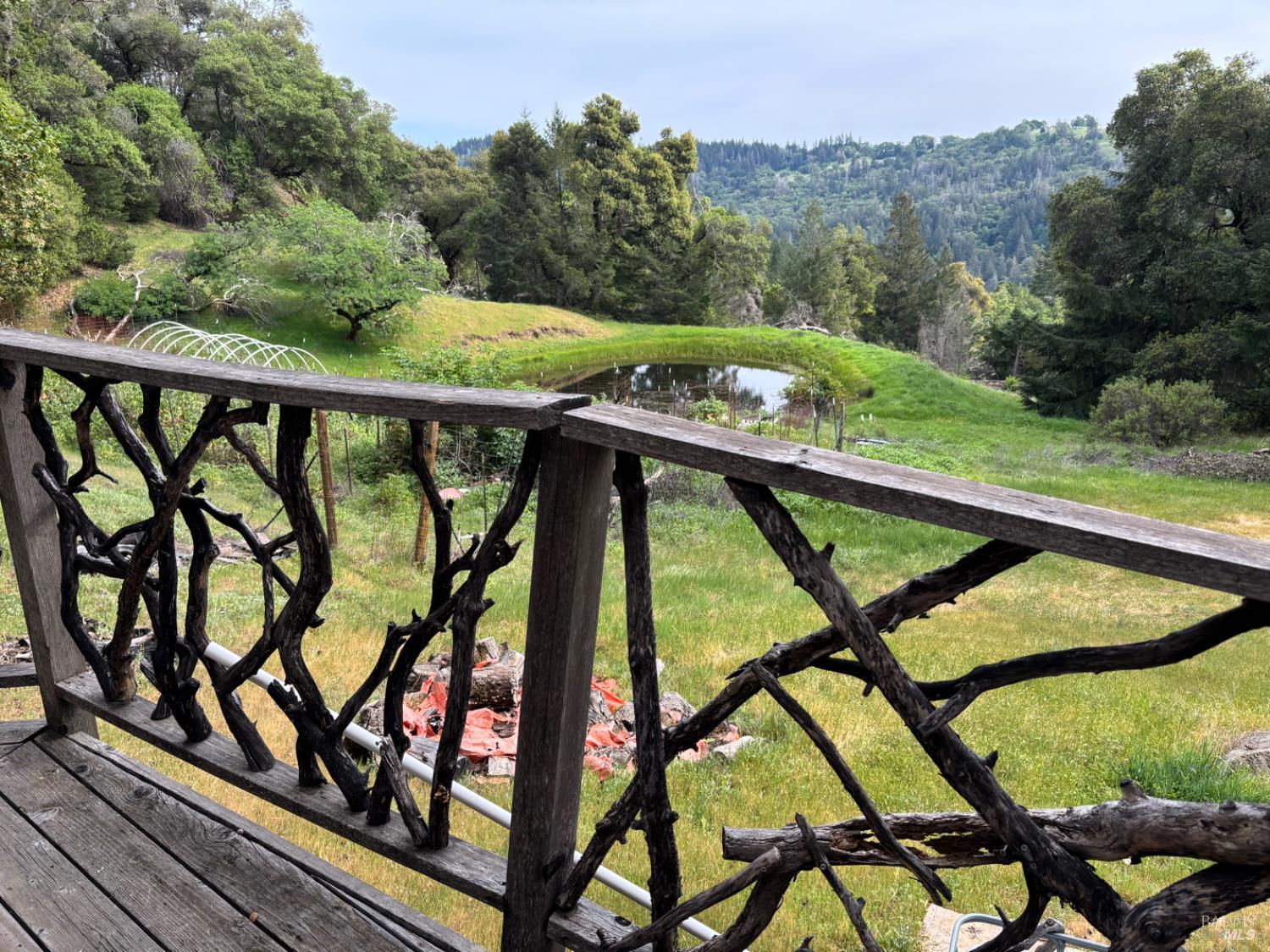 3701 Radical Ridge Road Redwood Valley, CA 95470 - Photo 19 of 38 a view of a balcony with furniture and wooden floor