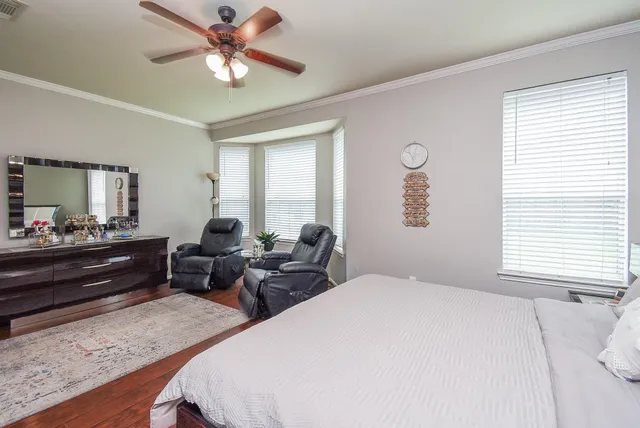 a bed room with two bed and a large window