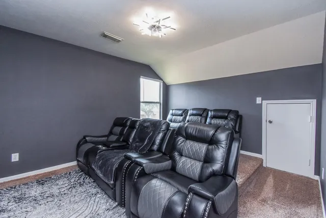 a bedroom with a bed and ceiling fan