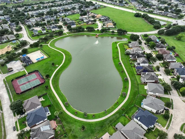 a view of a swimming pool in a backyard
