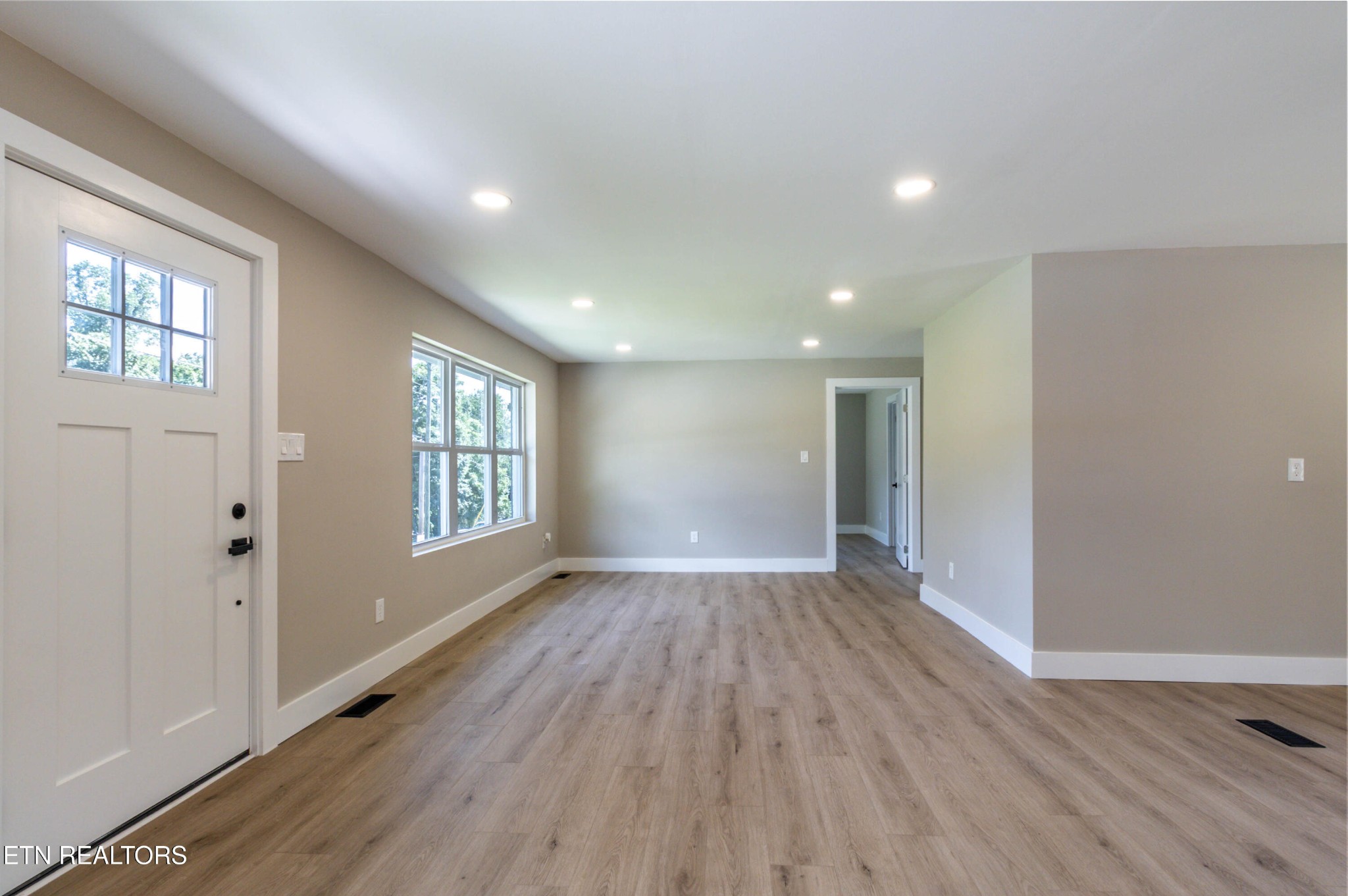 505 Foust Carney Road Powell, TN 37849 - Photo 13 of 40 wooden floor in an empty room with a window
