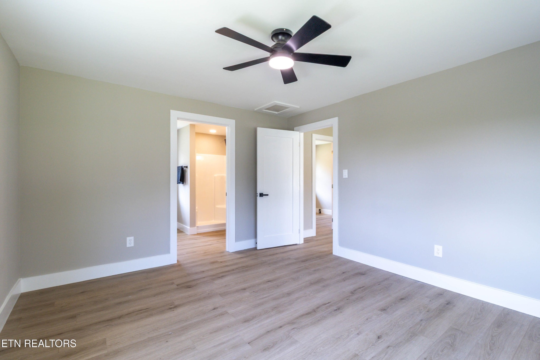505 Foust Carney Road Powell, TN 37849 - Photo 15 of 40 wooden floor in an empty room with a window