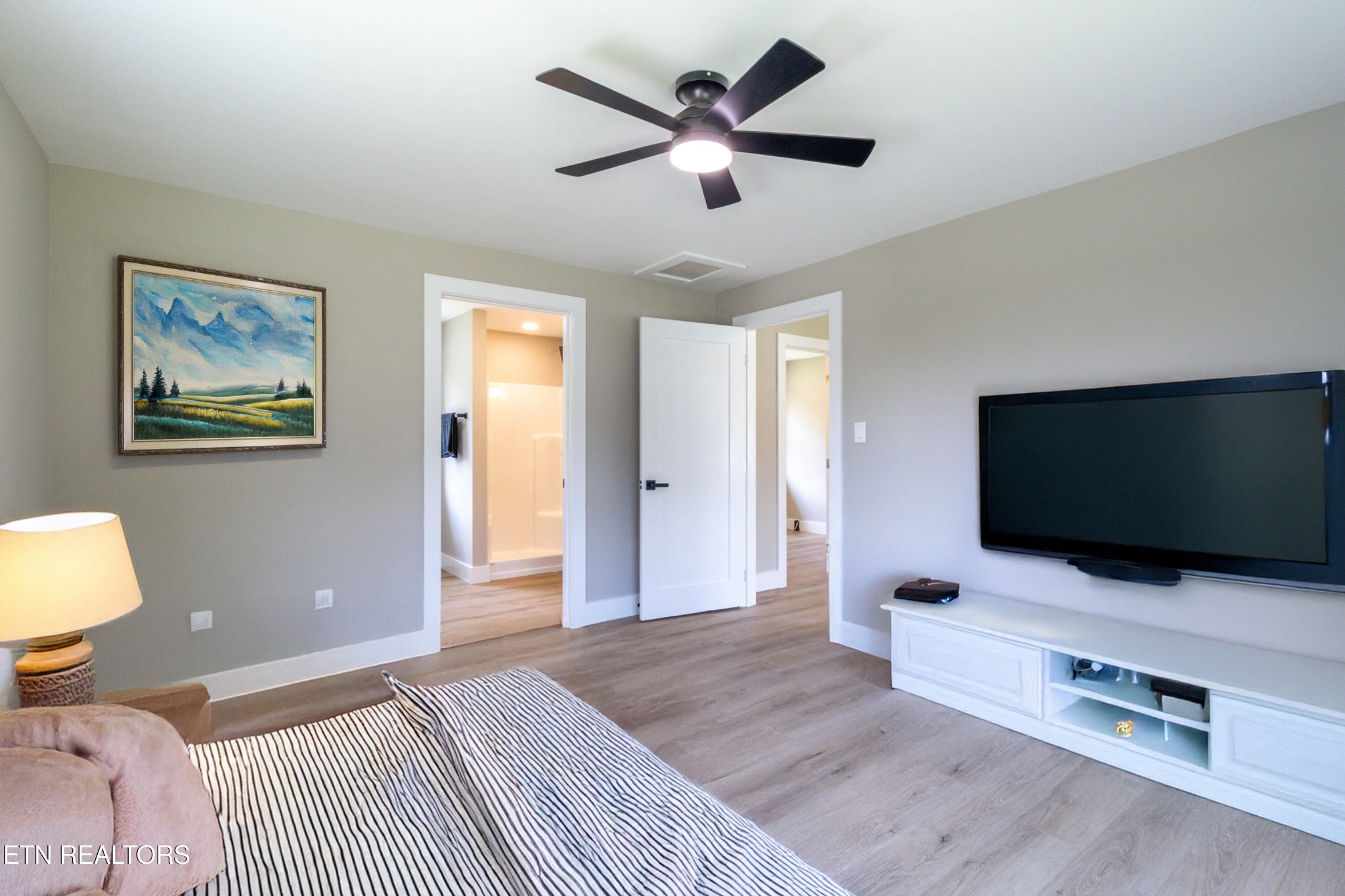 505 Foust Carney Road Powell, TN 37849 - Photo 16 of 40 a bedroom with a bed and a flat screen tv