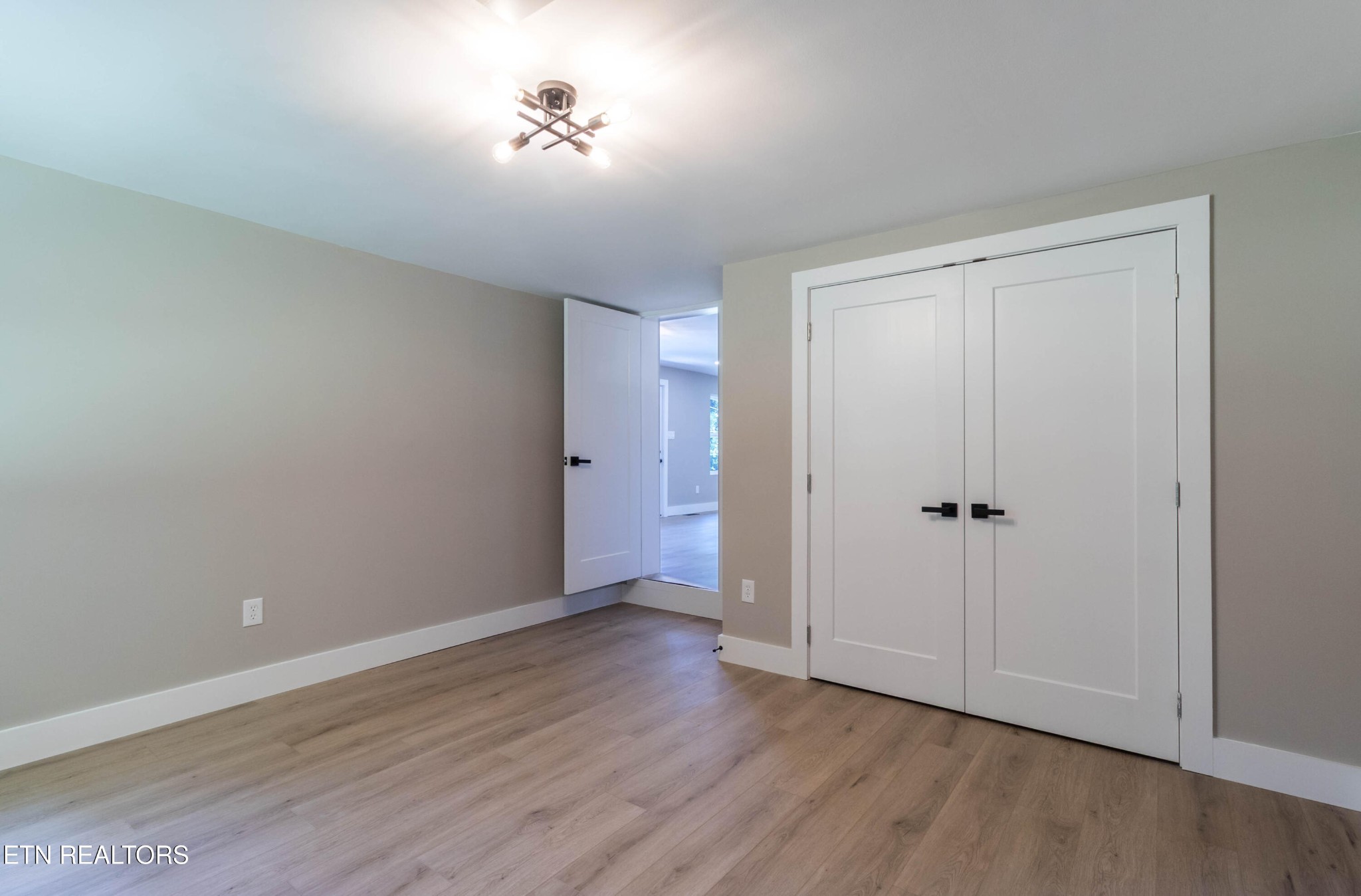 505 Foust Carney Road Powell, TN 37849 - Photo 26 of 40 a view of an empty room with wooden floor