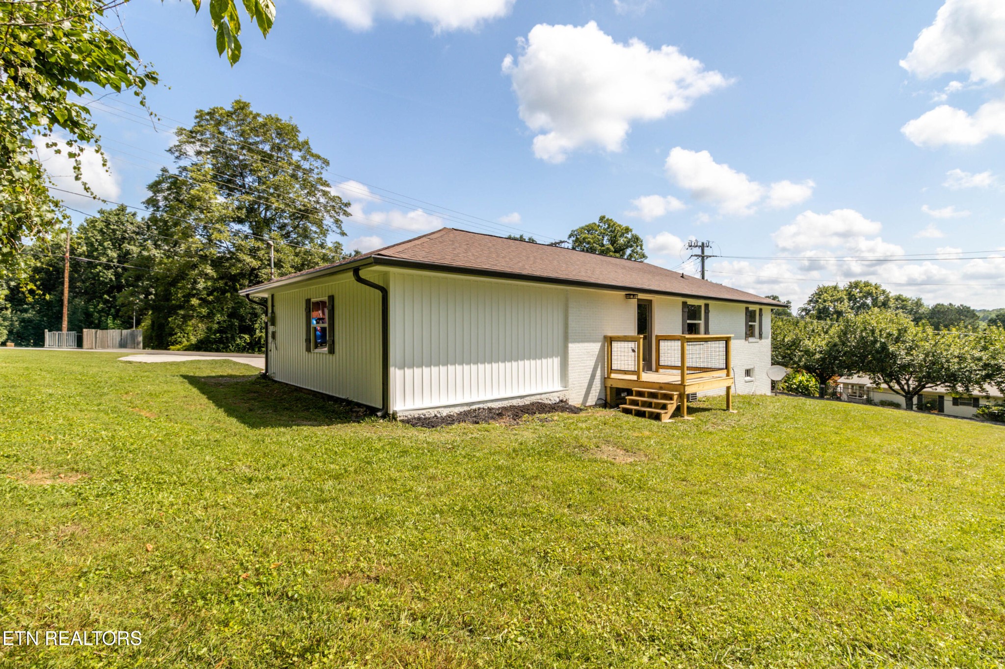 505 Foust Carney Road Powell, TN 37849 - Photo 32 of 40 a view of a house with backyard and sitting area