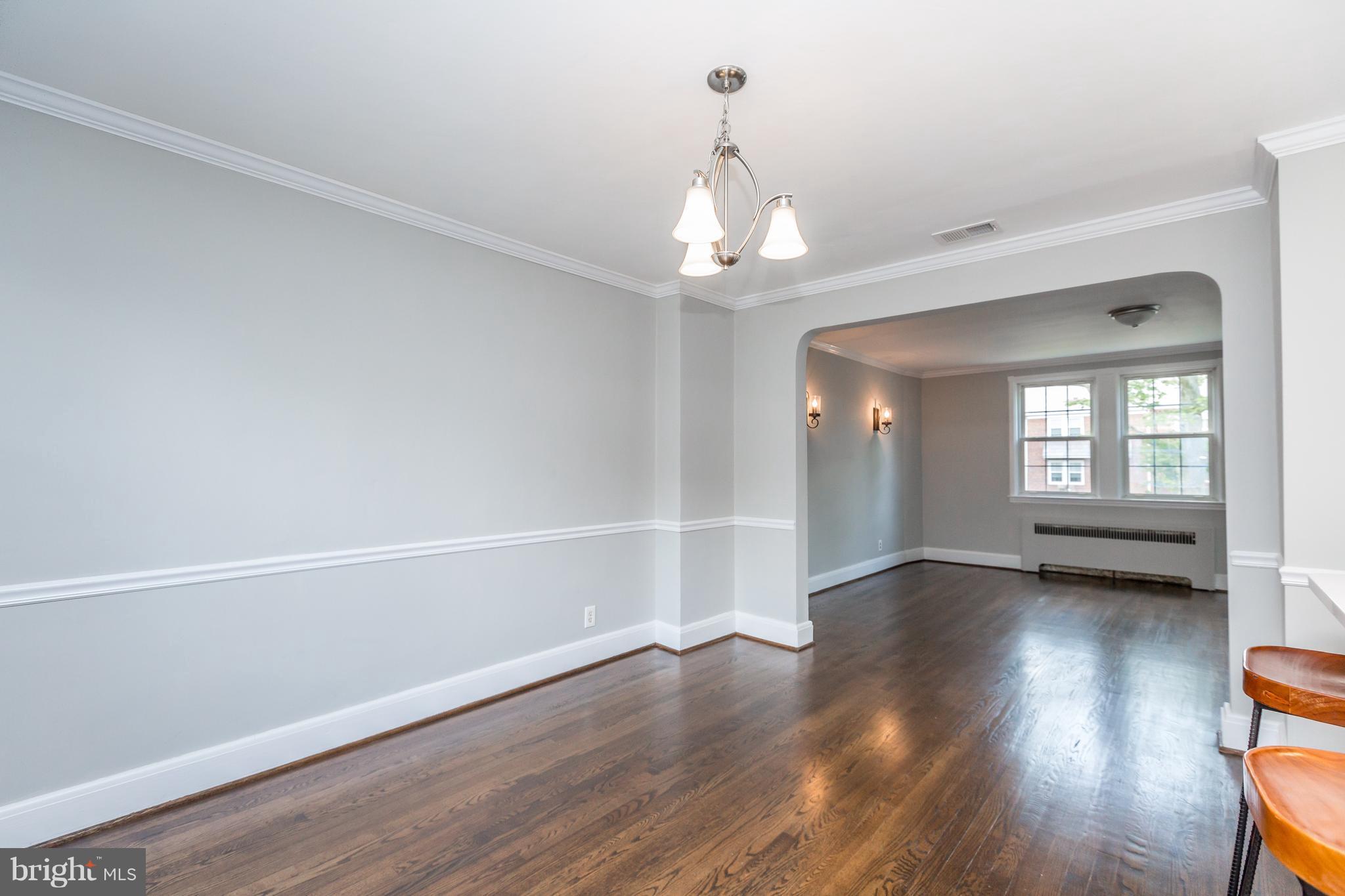 7 Murdock Road Baltimore, MD 21212 - Photo 11 of 30 a view of an empty room with wooden floor and a window