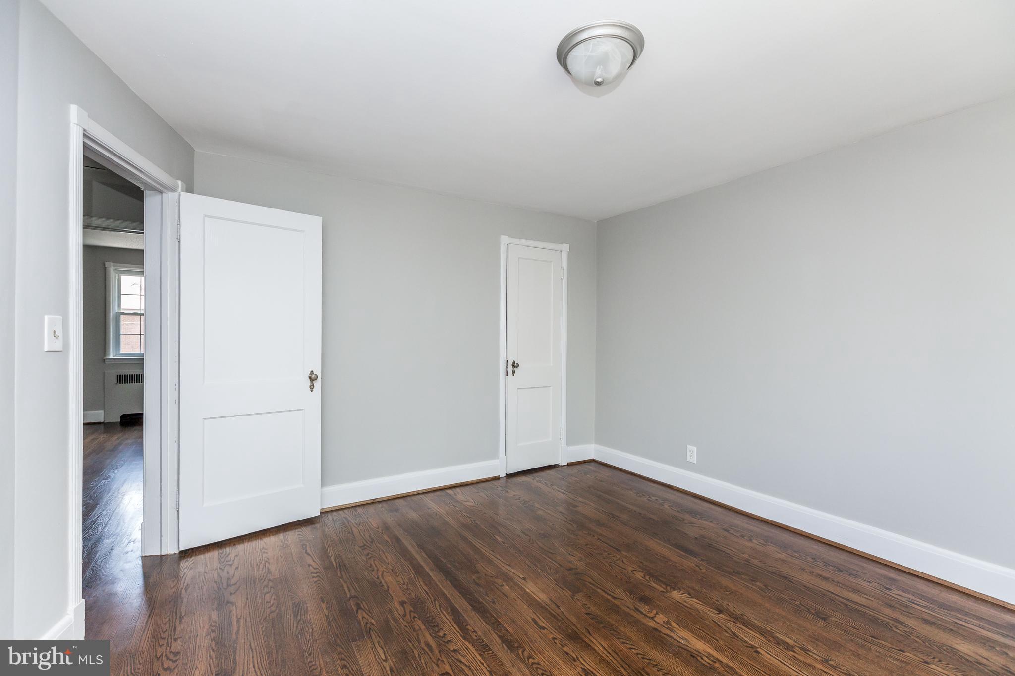 7 Murdock Road Baltimore, MD 21212 - Photo 12 of 30 an empty room with wooden floor and windows