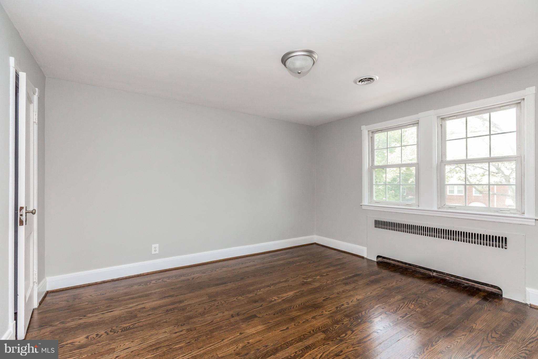 7 Murdock Road Baltimore, MD 21212 - Photo 15 of 30 wooden floor in an empty room with a window