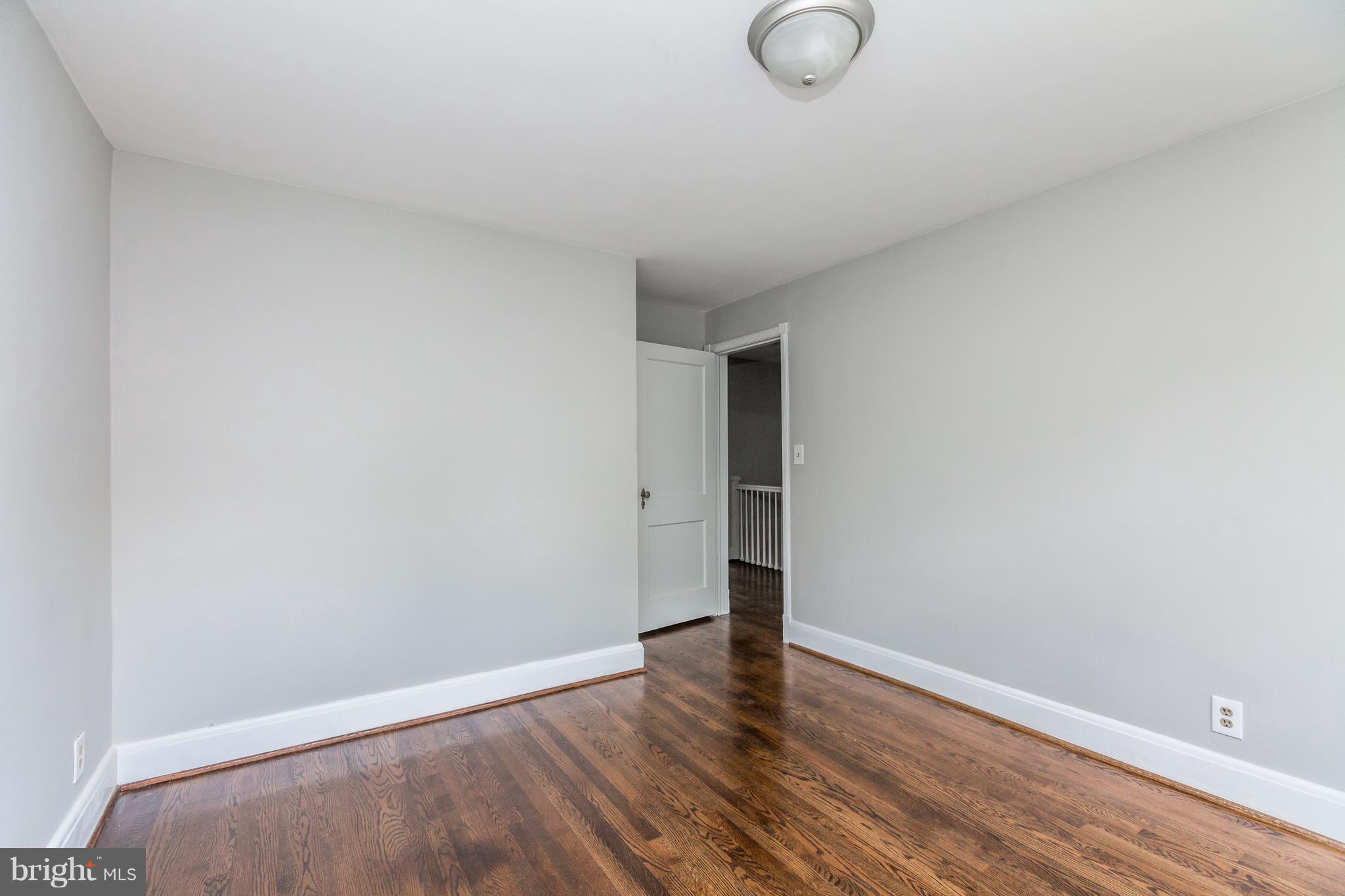 7 Murdock Road Baltimore, MD 21212 - Photo 16 of 30 a view of room with wooden floor