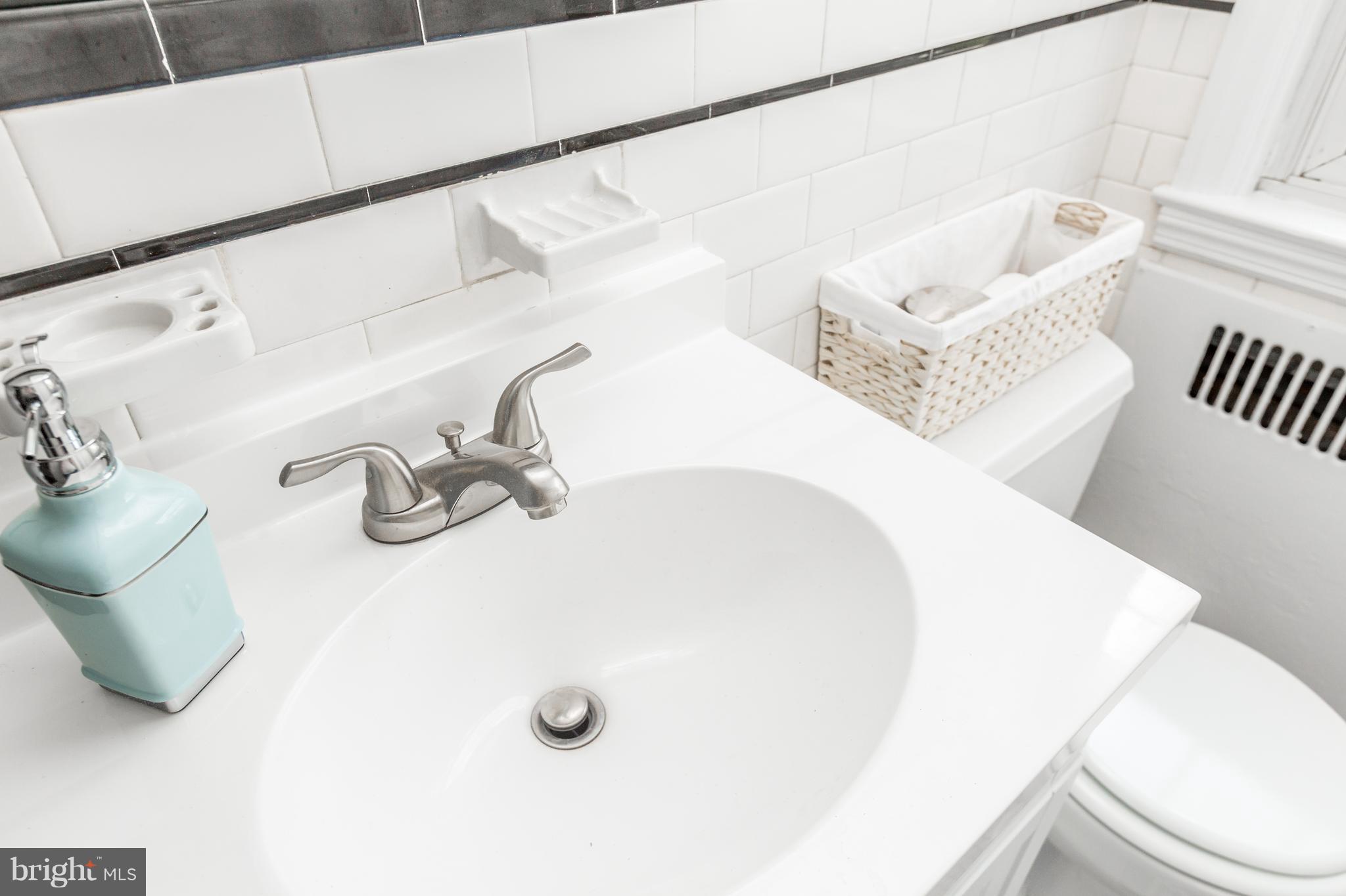 7 Murdock Road Baltimore, MD 21212 - Photo 21 of 30 a bathroom with a sink and a mirror