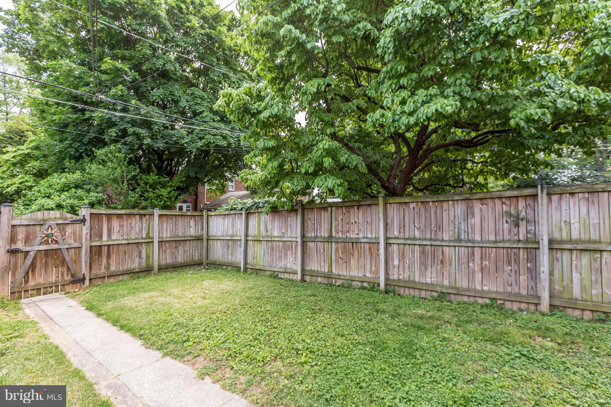 7 Murdock Road Baltimore, MD 21212 - Photo 29 of 30 a view of a backyard with a small cabin and wooden fence