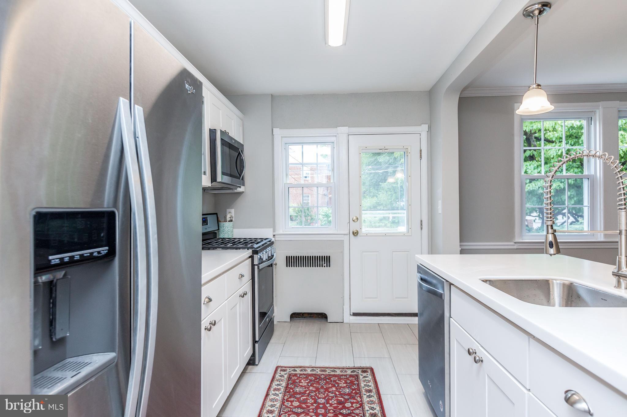 7 Murdock Road Baltimore, MD 21212 - Photo 9 of 30 a kitchen with a sink stove and refrigerator