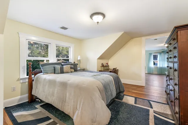 a bed room with a bed and a window