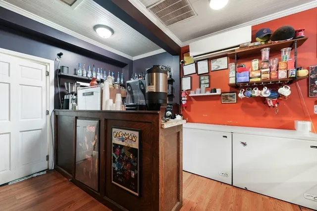 a kitchen with stainless steel appliances granite countertop a refrigerator and a stove
