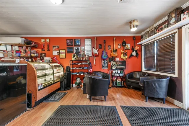 a bedroom with furniture and a rug