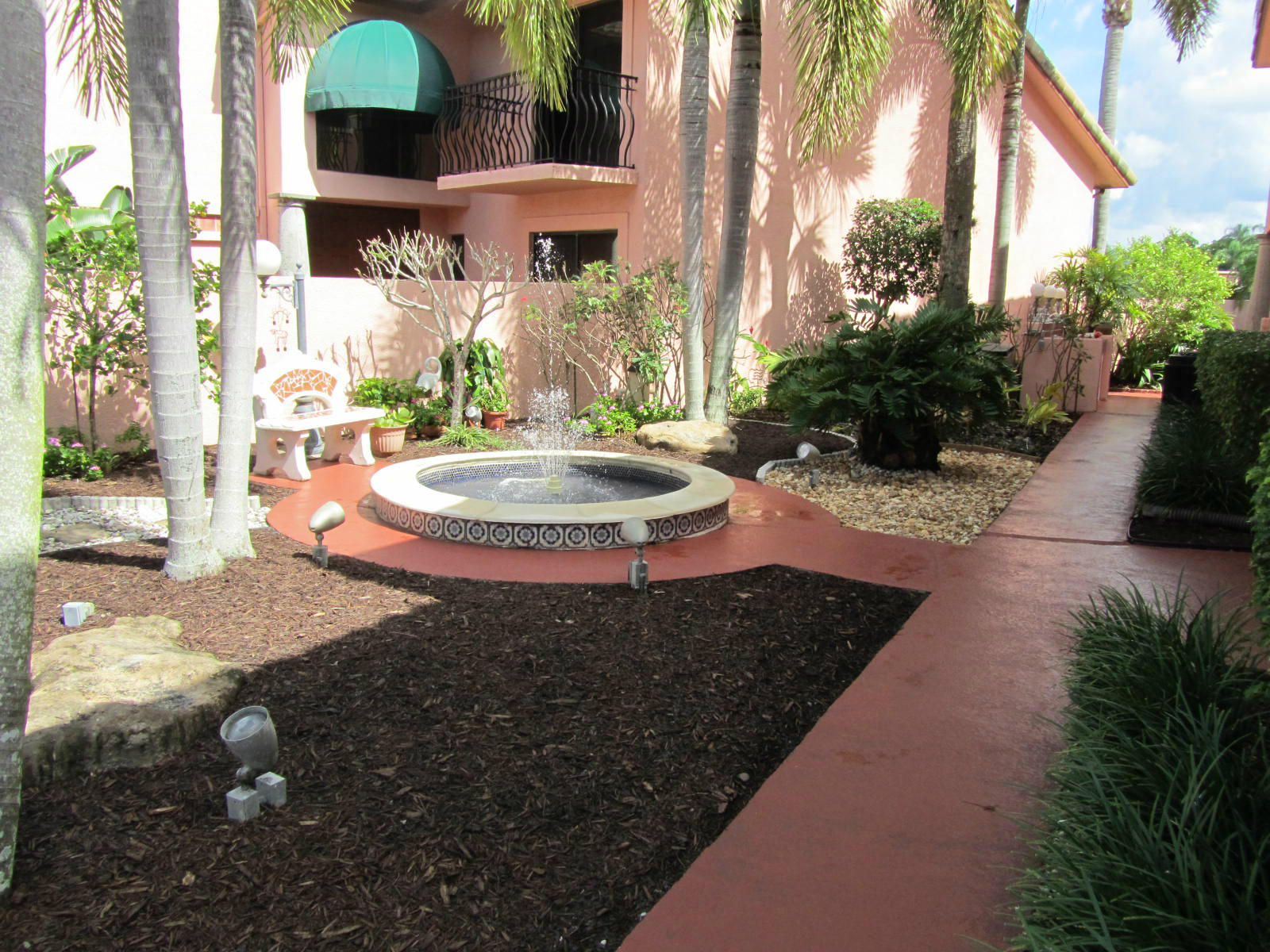 6489 Via Benita Boca Raton, FL 33433 - Photo 24 of 27 Side yard with water fountain