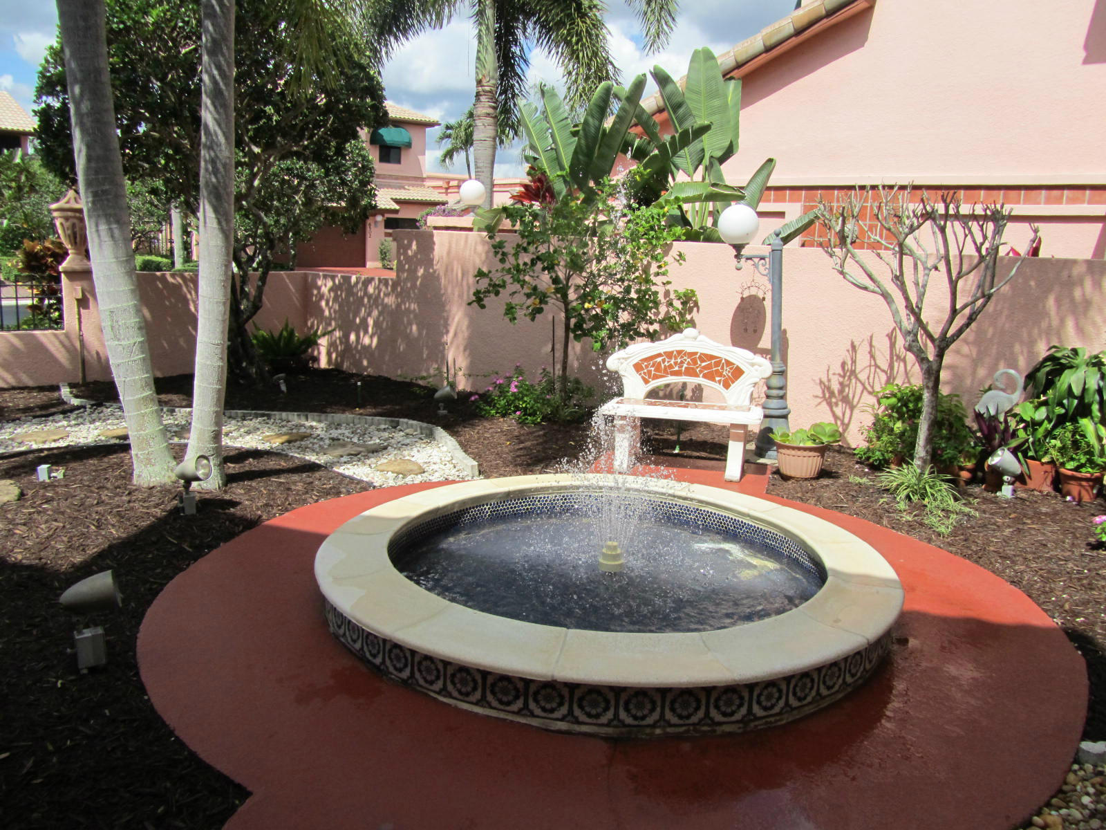 6489 Via Benita Boca Raton, FL 33433 - Photo 25 of 27 Side yard with water fountain