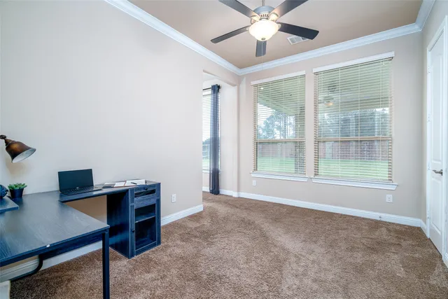 a view of workspace with furniture and window