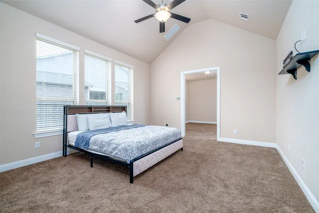 a bedroom with a bed and window