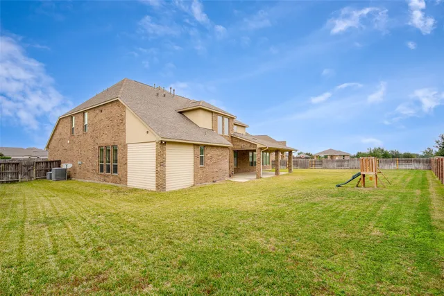 a view of a house with a big yard