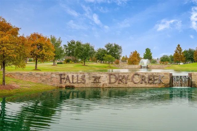 a view of a lake with a yard