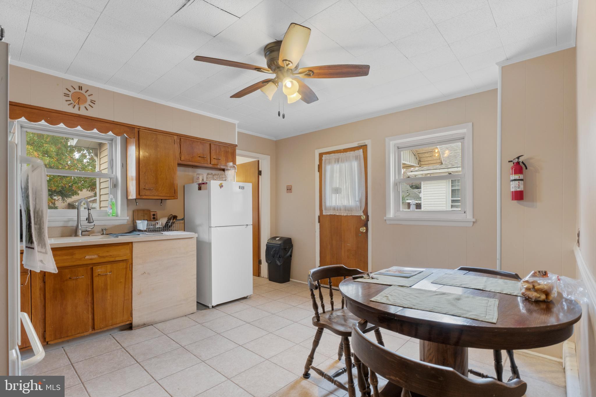 69 Reed Avenue Hamilton, NJ 08610 - Photo 6 of 17 a kitchen with a dining table and chairs