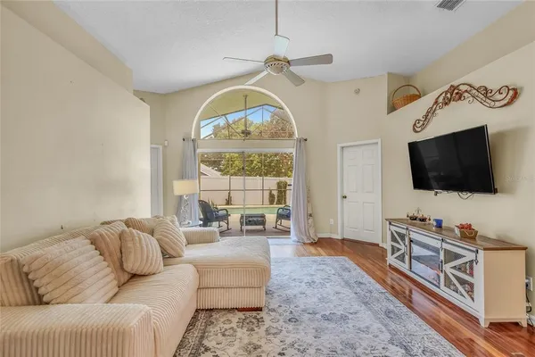 a living room with furniture and a flat screen tv