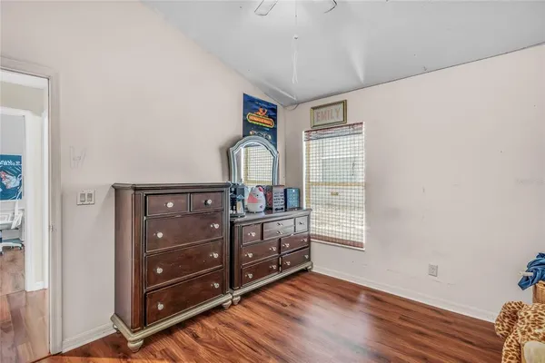 a view of a dresser with wooden floor