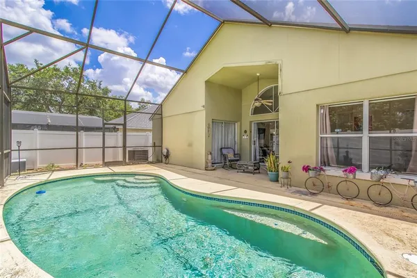 a front view of a house with a yard table and chairs
