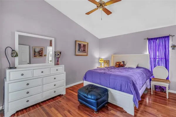 a bedroom with a bed and a dresser