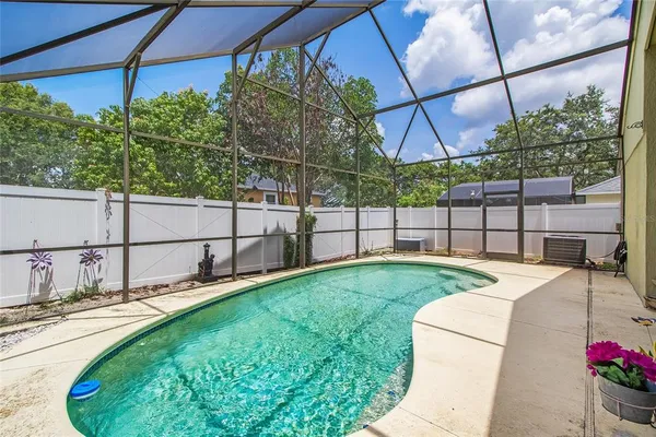 a view of a backyard with sitting area