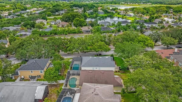 an aerial view of a house with a yard basket ball court and outdoor seating