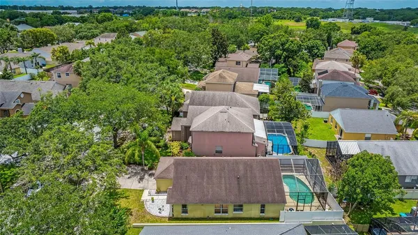 an aerial view of house with yard swimming pool and outdoor seating