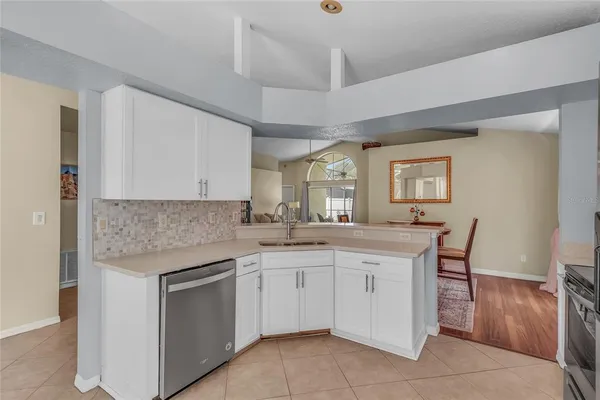 a kitchen with a sink and cabinets