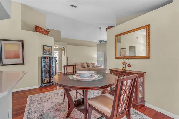 a dining room with furniture and window