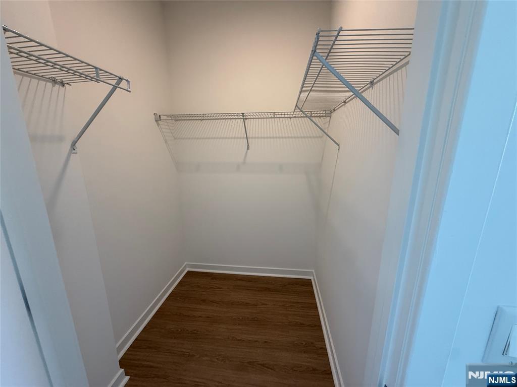 2050 North Central Road, Unit 710 Fort Lee, NJ 07024 - Photo 8 of 21 a view of a room with racks on the wall