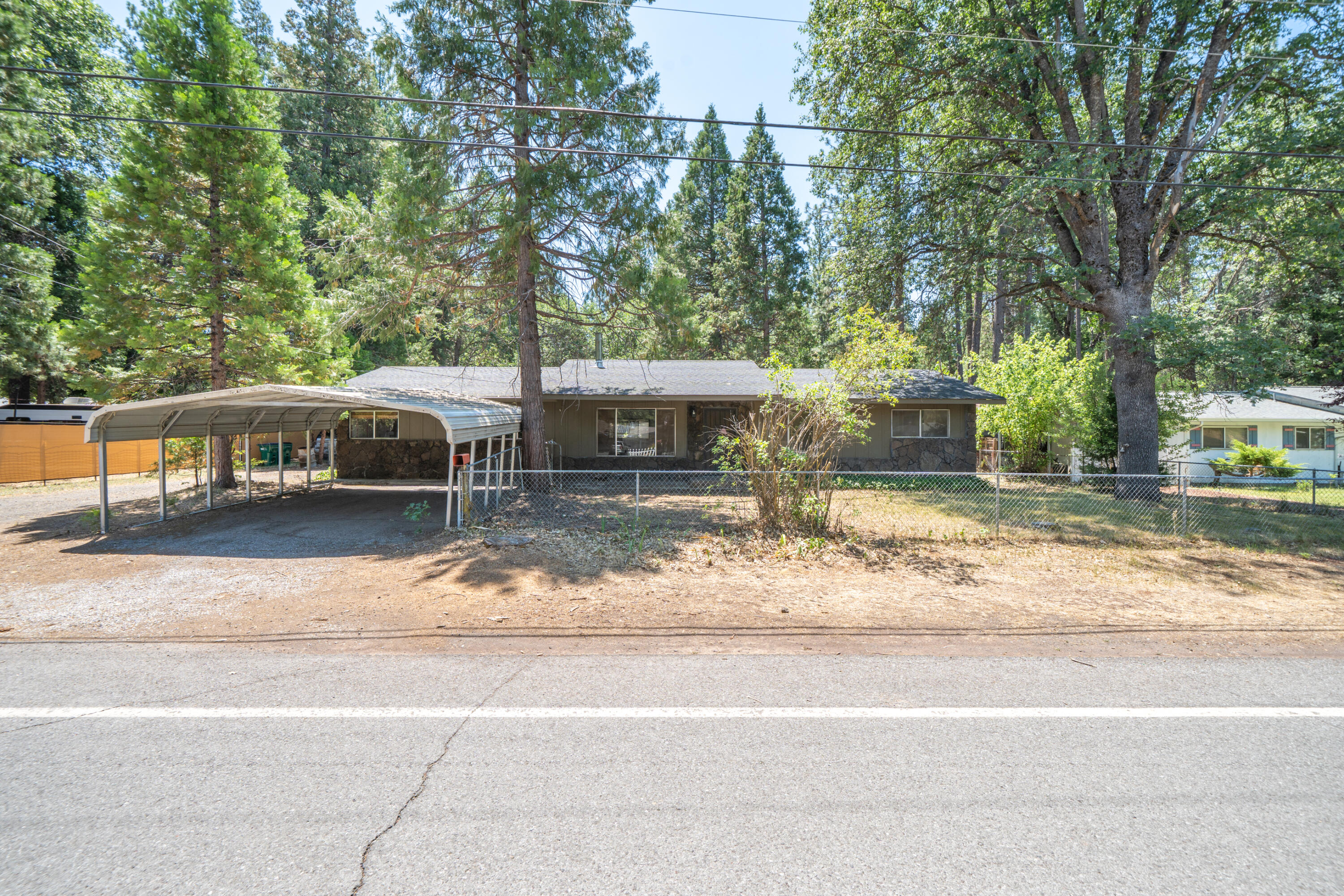 37347 Cypress Avenue Burney, CA 96013 - Photo 1 of 62 a view of a house with a yard and large tree