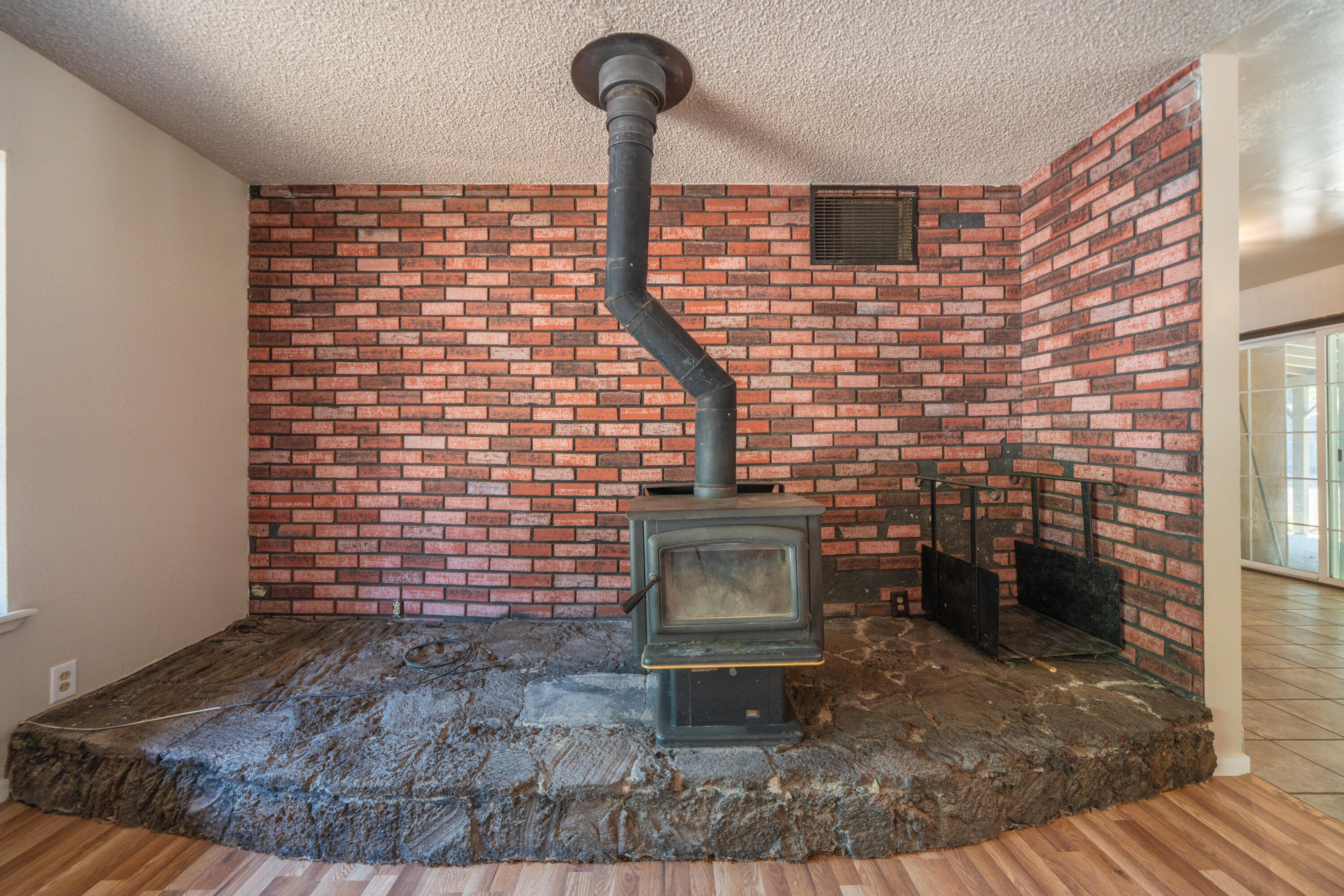 37347 Cypress Avenue Burney, CA 96013 - Photo 13 of 62 a brick building with a bench in it