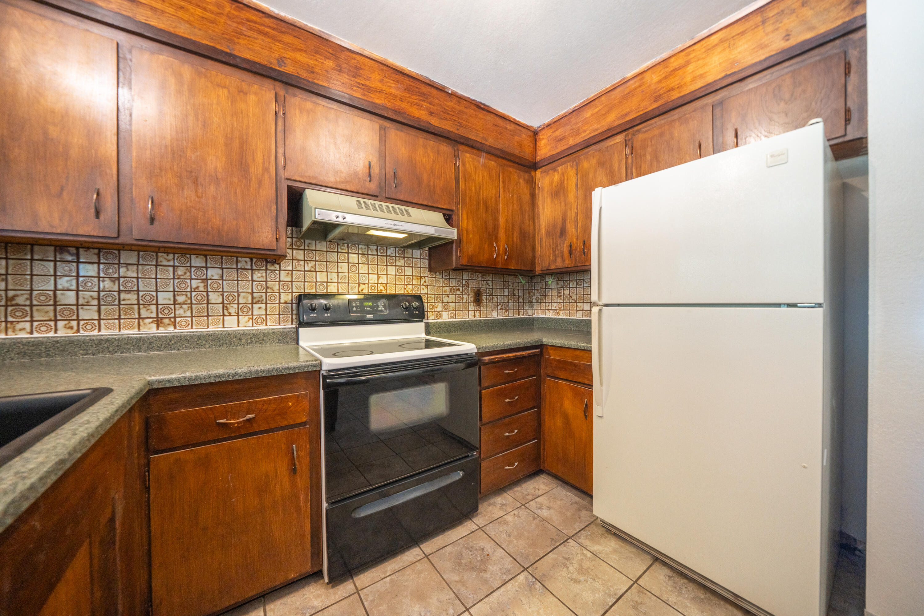 37347 Cypress Avenue Burney, CA 96013 - Photo 18 of 62 a kitchen with stainless steel appliances granite countertop a refrigerator a stove a sink and a microwave