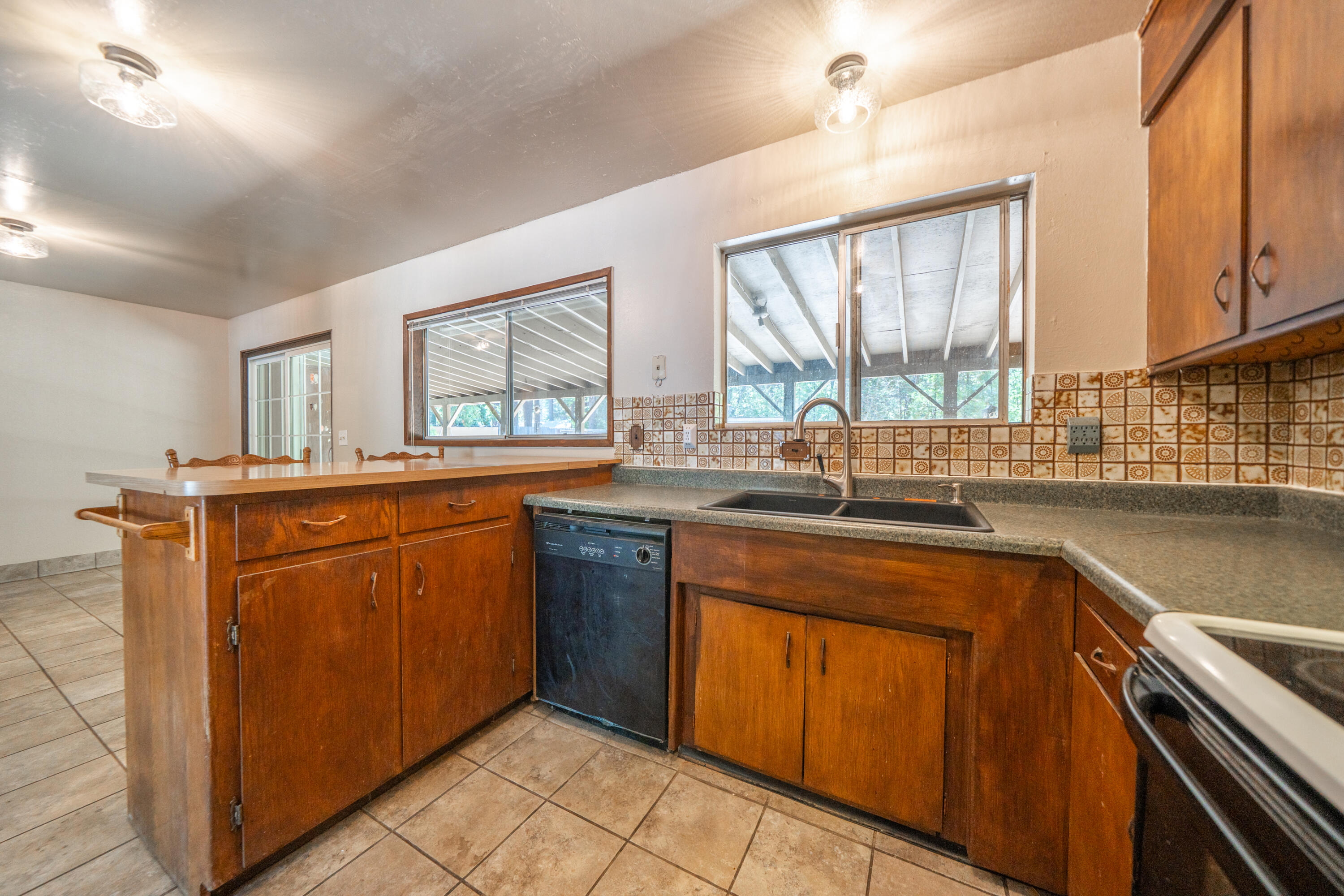 37347 Cypress Avenue Burney, CA 96013 - Photo 19 of 62 a kitchen with stainless steel appliances granite countertop a sink and a stove