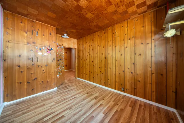a bathroom with a granite countertop sink mirror and toilet