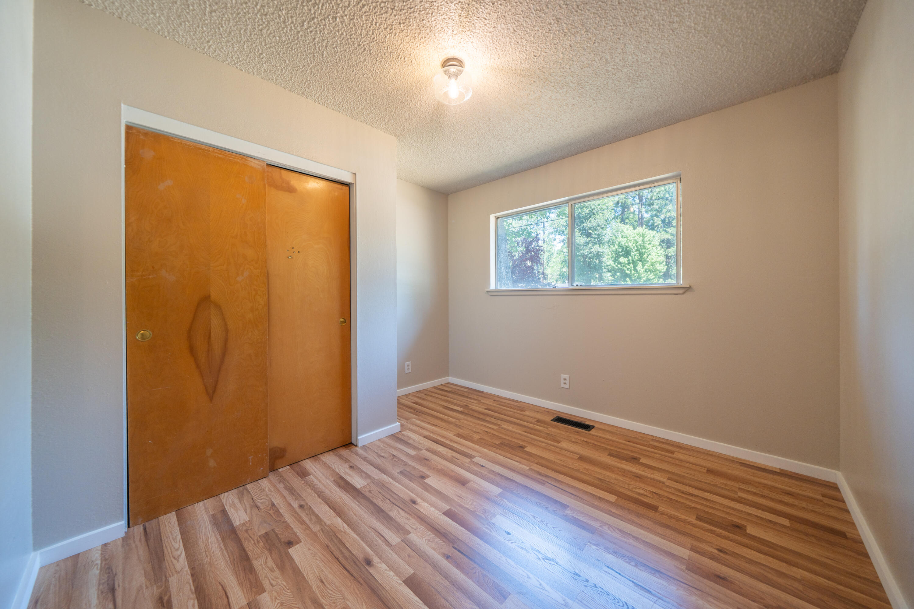 37347 Cypress Avenue Burney, CA 96013 - Photo 26 of 62 a view of room with wooden floor and fan